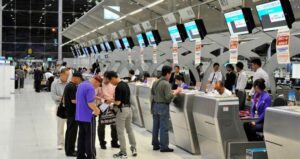 people checking in at the airport